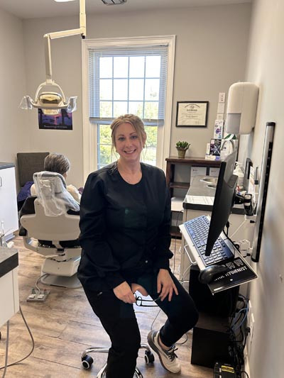 Hygienist preparing a patient for a cleaning at Wrightsville Dental