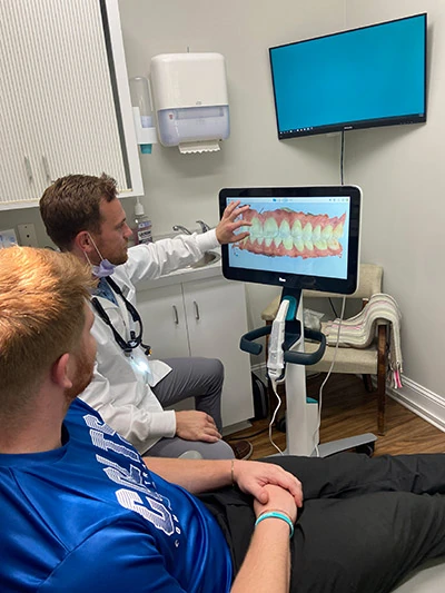 Dr. Watt of Wrightsville Dental discussing x-rays with a patient during his first visit